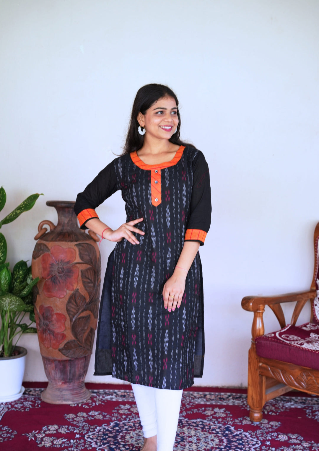 Sambalpuri Women’s Kurti – Black with Orange Collar and Cuff Detailing in Traditional Ikat Pattern