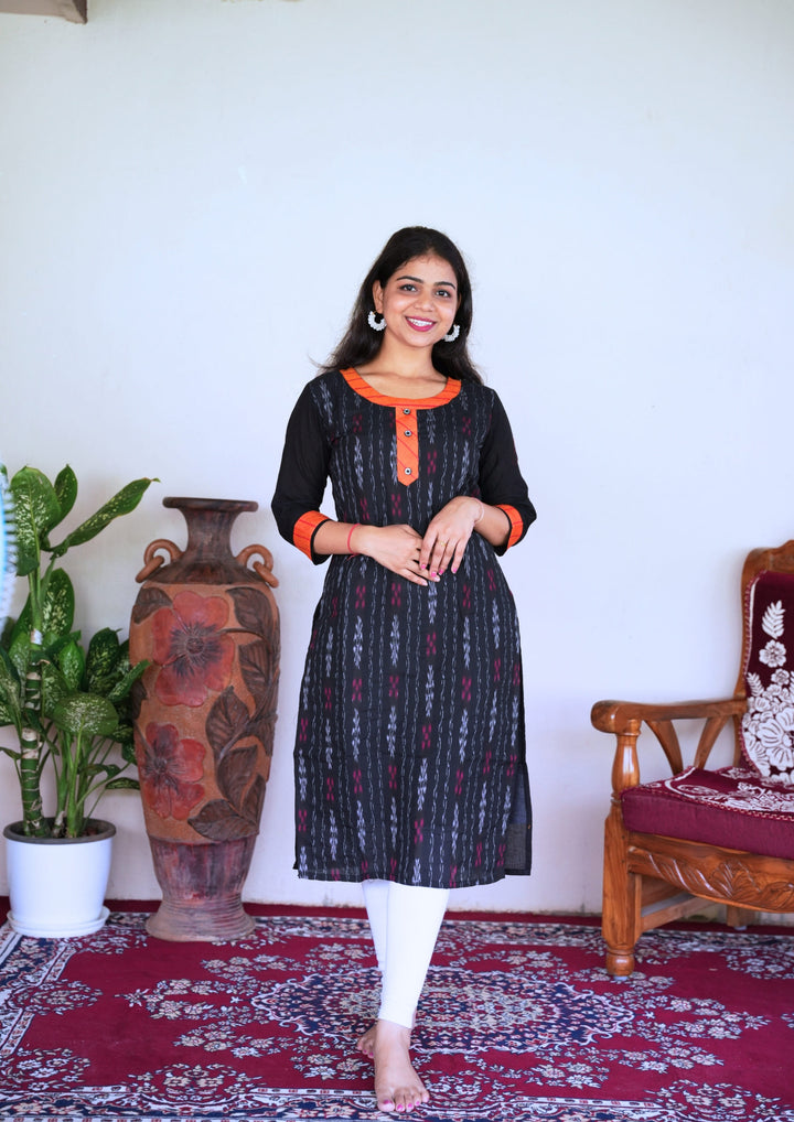 Sambalpuri Women’s Kurti – Black with Orange Collar and Cuff Detailing in Traditional Ikat Pattern