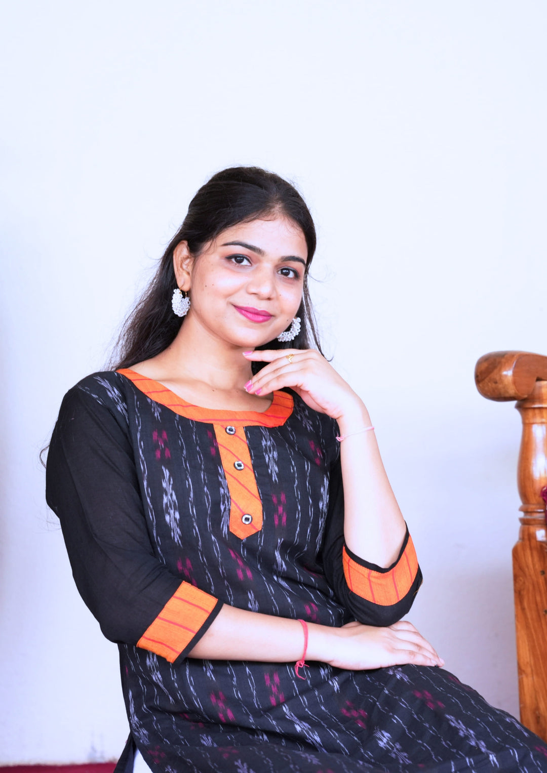 Sambalpuri Women’s Kurti – Black with Orange Collar and Cuff Detailing in Traditional Ikat Pattern