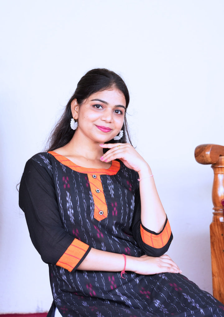 Sambalpuri Women’s Kurti – Black with Orange Collar and Cuff Detailing in Traditional Ikat Pattern