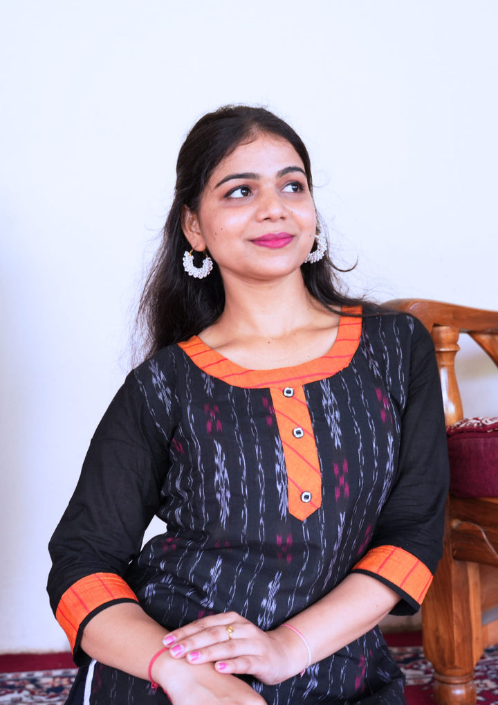 Sambalpuri Women’s Kurti – Black with Orange Collar and Cuff Detailing in Traditional Ikat Pattern