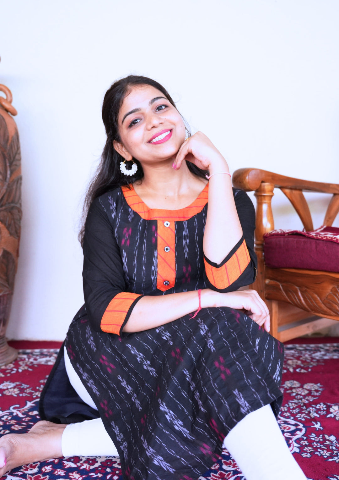 Sambalpuri Women’s Kurti – Black with Orange Collar and Cuff Detailing in Traditional Ikat Pattern