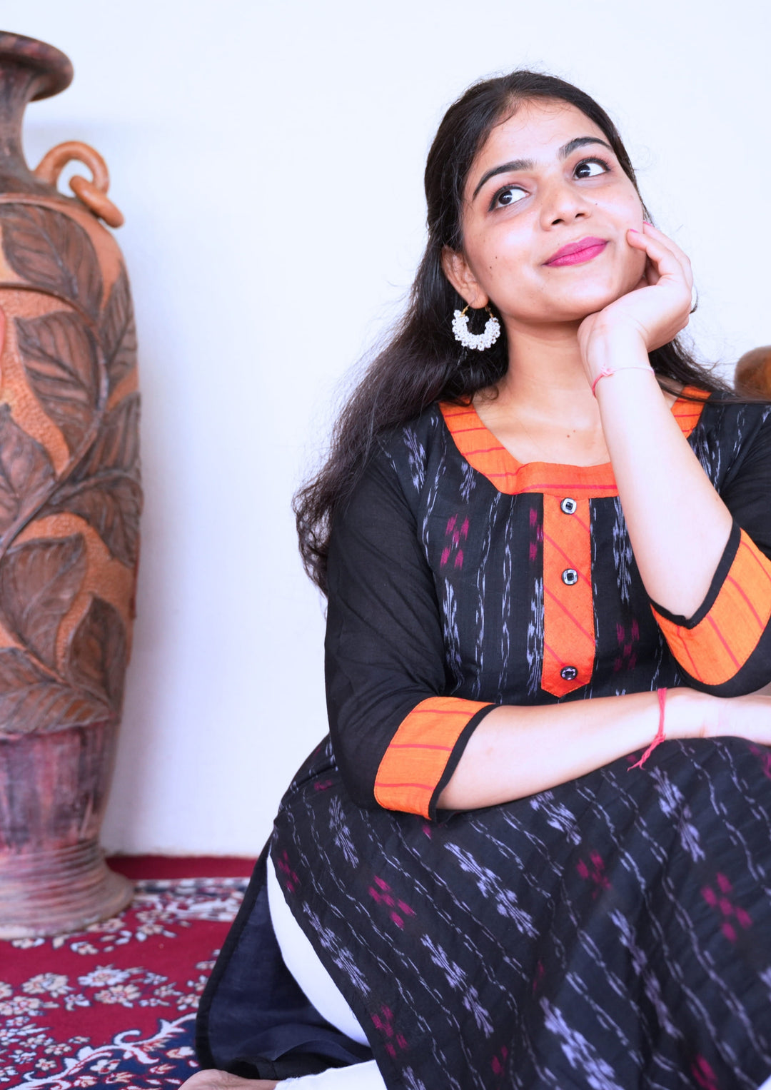 Sambalpuri Women’s Kurti – Black with Orange Collar and Cuff Detailing in Traditional Ikat Pattern